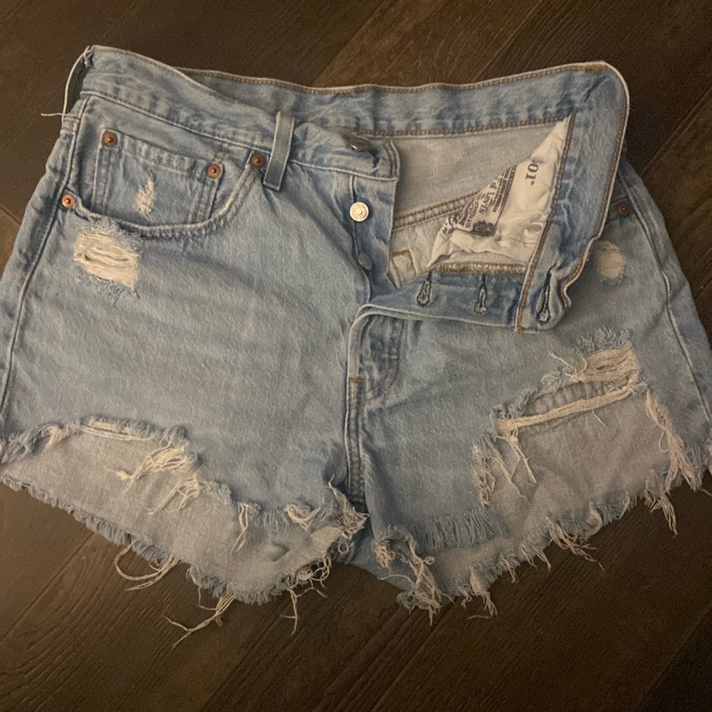 501 Levi high rise shorts , light wash , distressed.
